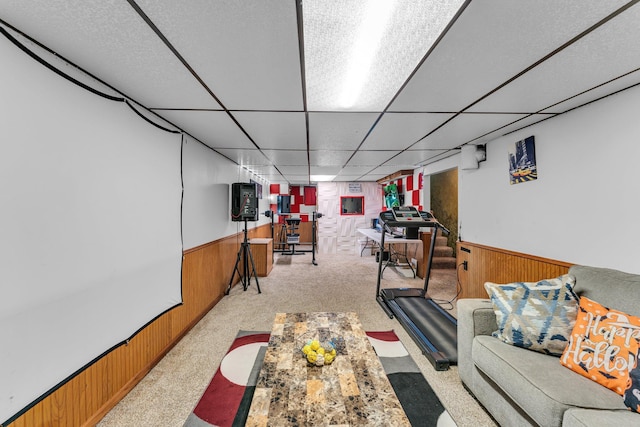 5215 Washburn Ave N, Minneapolis, MN 55430 - exercise room with a wainscoted wall, wood walls, a paneled ceiling, and light carpet