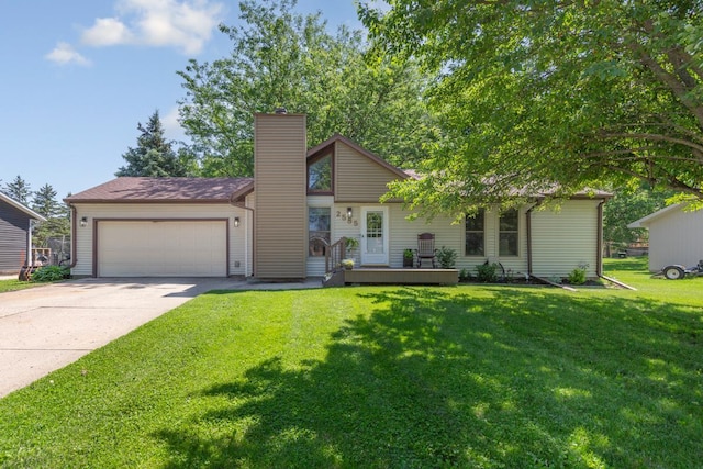 2585 3rd Ave NE, Owatonna, MN 55060 - view of front facade with a chimney, a garage, concrete driveway, and a front lawn