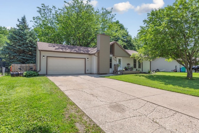 2585 3rd Ave NE, Owatonna, MN 55060 - view of front facade featuring an attached garage, driveway, and a chimney