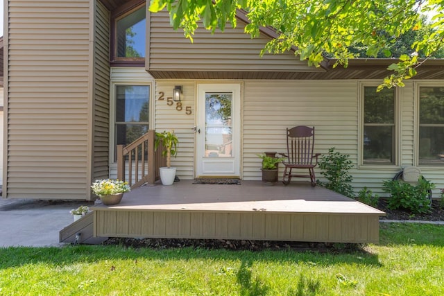 2585 3rd Ave NE, Owatonna, MN 55060 - property entrance featuring a deck and a yard