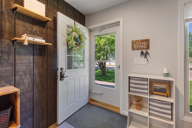 2585 3rd Ave NE, Owatonna, MN 55060 - doorway with a textured ceiling