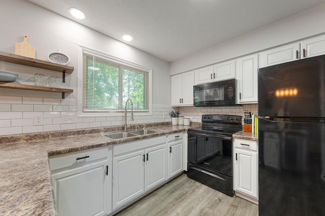 2585 3rd Ave NE, Owatonna, MN 55060 - kitchen with black appliances, light wood finished floors, white cabinets, and recessed lighting
