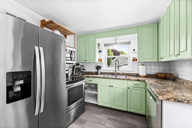 28 16th St, Cloquet, MN 55720 - kitchen with appliances with stainless steel finishes, open shelves, green cabinetry, and tasteful backsplash