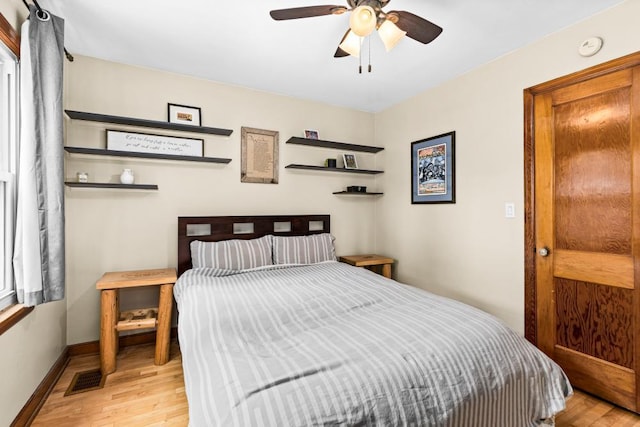 28 16th St, Cloquet, MN 55720 - bedroom featuring light wood-type flooring and a ceiling fan