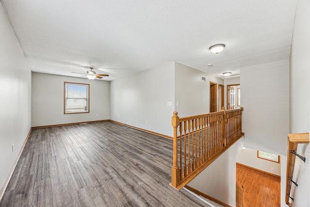 6773 Urbandale Ln N, Maple Grove, MN 55311 - unfurnished room featuring wood finished floors, ceiling fan, and a textured ceiling