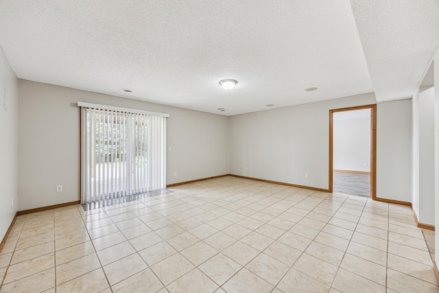 6773 Urbandale Ln N, Maple Grove, MN 55311 - empty room with a textured ceiling and light tile patterned flooring