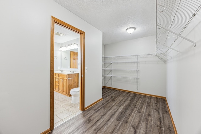6773 Urbandale Ln N, Maple Grove, MN 55311 - walk in closet featuring wood finished floors