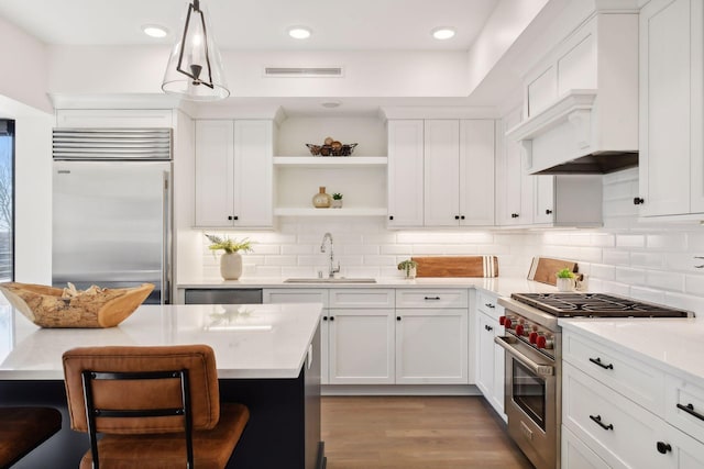 222 Ferndale Rd S, Wayzata, MN 55391 - kitchen featuring premium appliances, light countertops, tasteful backsplash, and recessed lighting