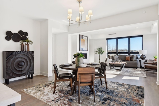 222 Ferndale Rd S, Wayzata, MN 55391 - dining space featuring wood finished floors and a chandelier