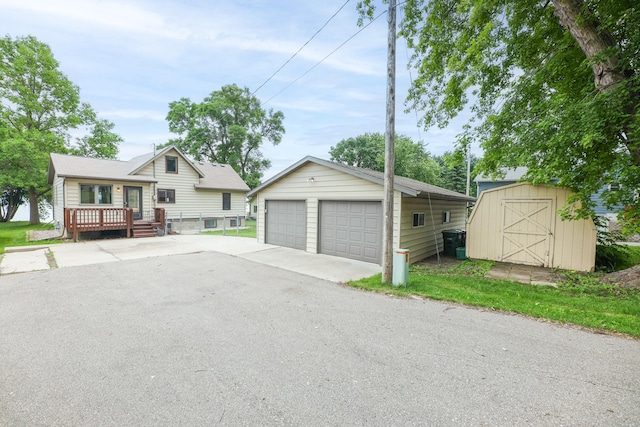 17 Lake St, Osakis, MN 56360 - tri-level home with an outbuilding, a garage, and a wooden deck
