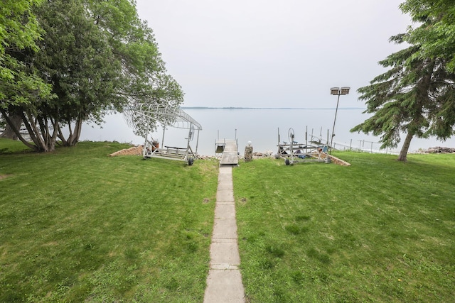 17 Lake St, Osakis, MN 56360 - view of grassy yard with a boat dock and a water view