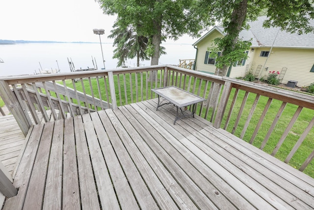17 Lake St, Osakis, MN 56360 - wooden deck featuring a water view and a yard
