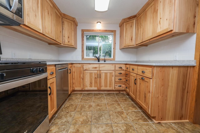 17 Lake St, Osakis, MN 56360 - kitchen with stainless steel appliances, light stone finish flooring, and decorative backsplash