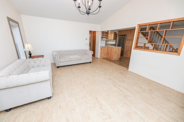 17 Lake St, Osakis, MN 56360 - living room with a chandelier, light wood-style flooring, and high vaulted ceiling