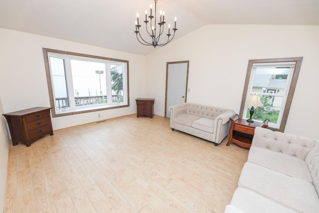 17 Lake St, Osakis, MN 56360 - living room with light wood finished floors, a chandelier, lofted ceiling, and healthy amount of natural light