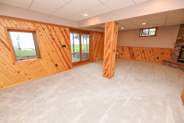 17 Lake St, Osakis, MN 56360 - basement with wooden walls, carpet, a drop ceiling, and a brick fireplace