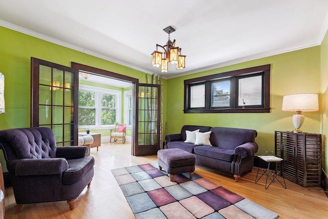 1725 Hague Ave Unit 4, Saint Paul, MN 55104 - living area with a chandelier, wood finished floors, and ornamental molding