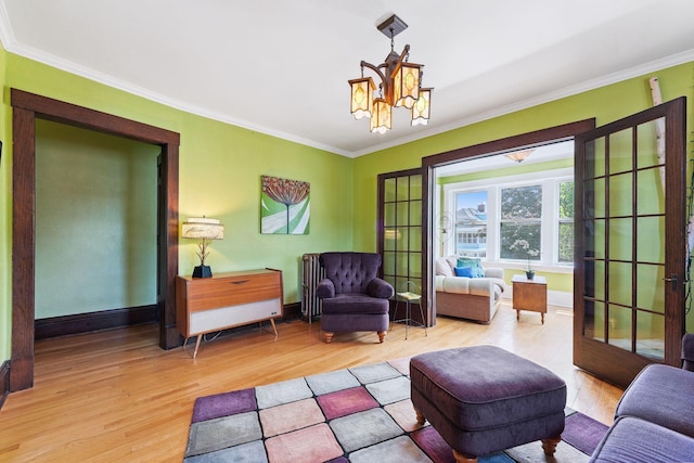 1725 Hague Ave Unit 4, Saint Paul, MN 55104 - sitting room with wood finished floors, ornamental molding, and a chandelier