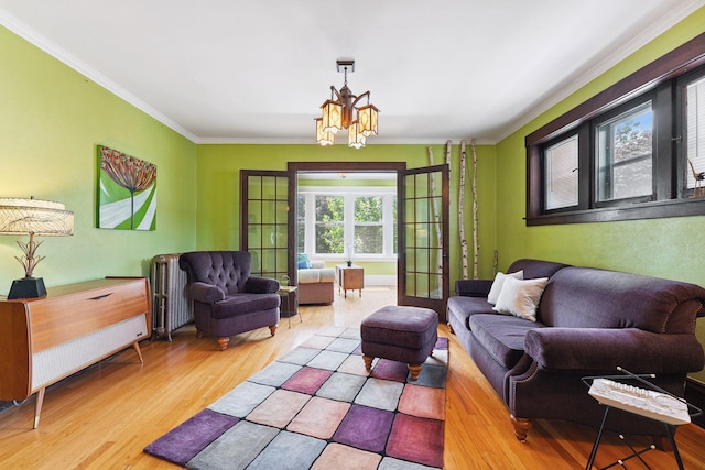 1725 Hague Ave Unit 4, Saint Paul, MN 55104 - living room featuring crown molding, wood finished floors, and a chandelier