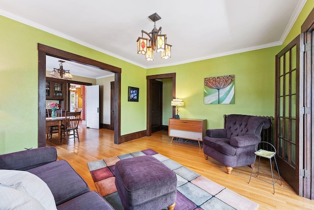 1725 Hague Ave Unit 4, Saint Paul, MN 55104 - living room featuring a chandelier, wood finished floors, and ornamental molding
