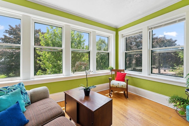 1725 Hague Ave Unit 4, Saint Paul, MN 55104 - sunroom with plenty of natural light, ornamental molding, and wood finished floors
