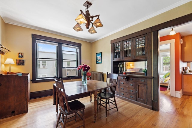 1725 Hague Ave Unit 4, Saint Paul, MN 55104 - dining area with light wood-type flooring, ornamental molding, and cooling unit