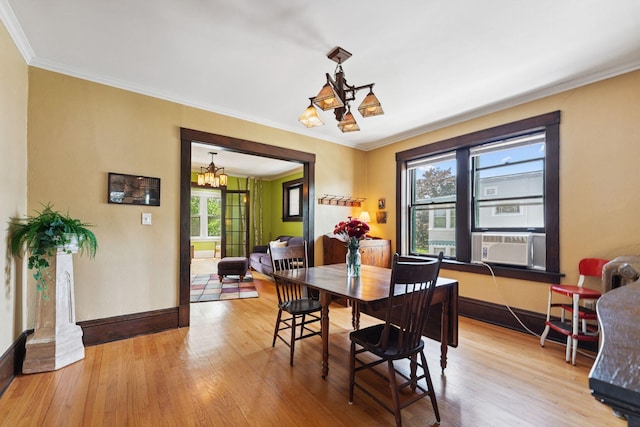 1725 Hague Ave Unit 4, Saint Paul, MN 55104 - dining room with a chandelier, wood finished floors, and ornamental molding
