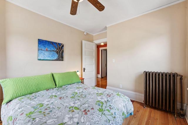 1725 Hague Ave Unit 4, Saint Paul, MN 55104 - bedroom featuring radiator, wood-type flooring, crown molding, and a ceiling fan