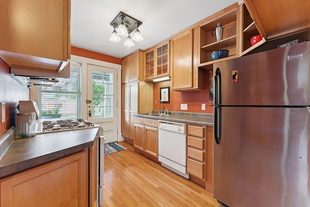 1725 Hague Ave Unit 4, Saint Paul, MN 55104 - kitchen with freestanding refrigerator, dishwasher, dark countertops, and light wood-style floors
