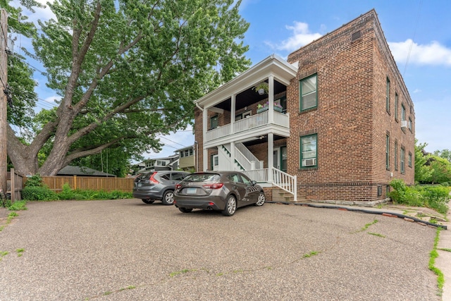 1725 Hague Ave Unit 4, Saint Paul, MN 55104 - view of front facade featuring brick siding and a balcony