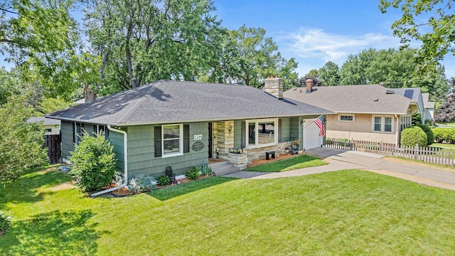 957 Hall Ave W, Saint Paul, MN 55118 - view of front of home with a chimney, driveway, an attached garage, and a shingled roof