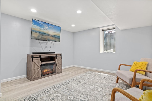 957 Hall Ave W, Saint Paul, MN 55118 - living area featuring wood finished floors, recessed lighting, and a glass covered fireplace