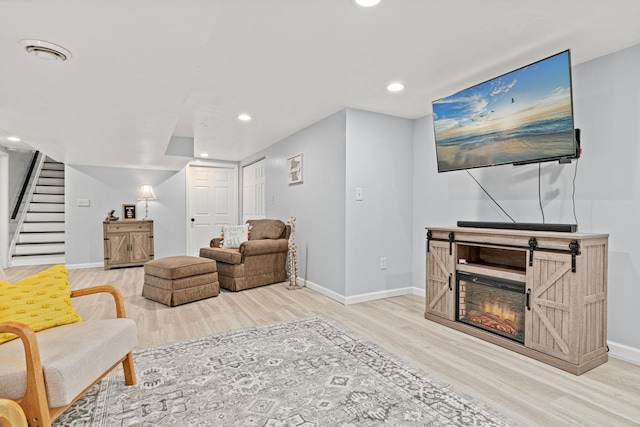 957 Hall Ave W, Saint Paul, MN 55118 - living room featuring wood finished floors, stairs, and recessed lighting