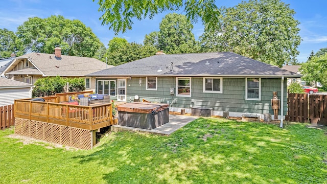 957 Hall Ave W, Saint Paul, MN 55118 - rear view of property featuring a hot tub, a fenced backyard, a wooden deck, and a shingled roof
