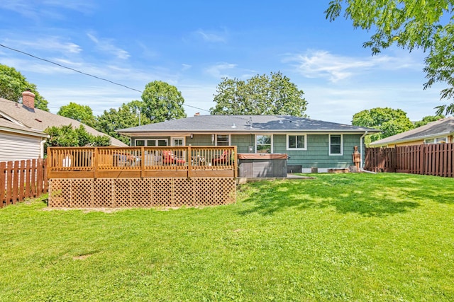 957 Hall Ave W, Saint Paul, MN 55118 - rear view of house with a hot tub, a fenced backyard, and a wooden deck