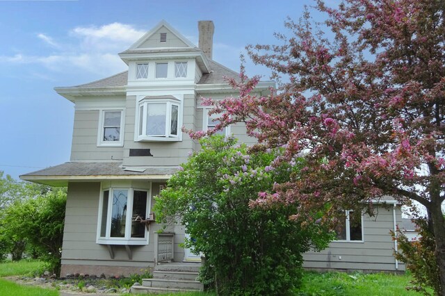 2332 7th St, Superior, WI 54880 - view of front of home featuring roof with shingles and a chimney