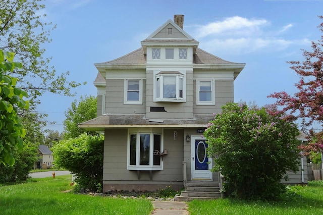 2332 7th St, Superior, WI 54880 - victorian-style house featuring a chimney and roof with shingles
