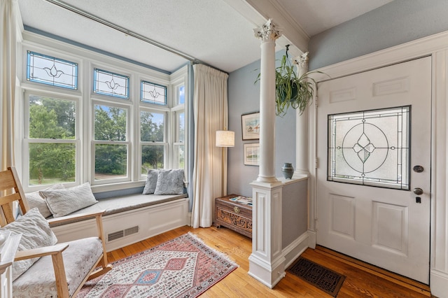 2145 Knapp St, Saint Paul, MN 55108 - entrance foyer with ornate columns and light wood-style floors