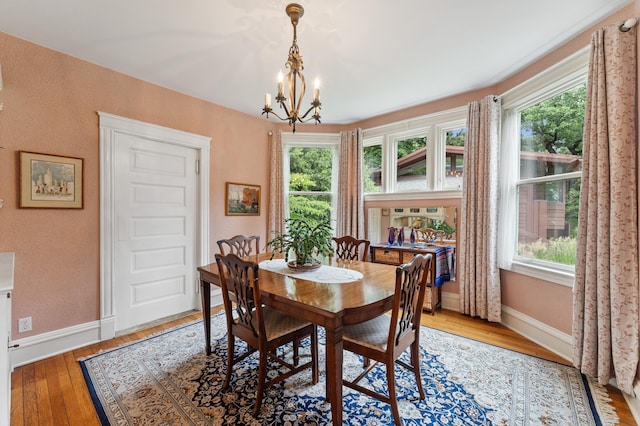 2145 Knapp St, Saint Paul, MN 55108 - dining area featuring a chandelier and light wood-style floors
