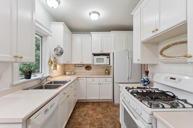 2145 Knapp St, Saint Paul, MN 55108 - kitchen with white appliances, decorative backsplash, white cabinetry, and light countertops