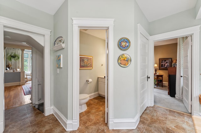 2145 Knapp St, Saint Paul, MN 55108 - hallway featuring baseboards and arched walkways
