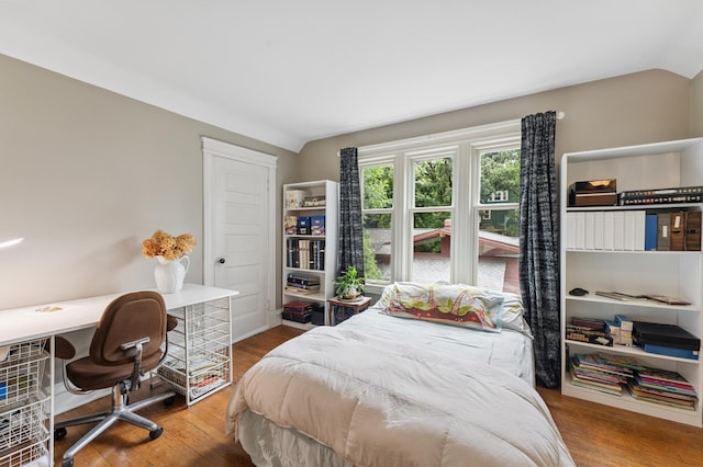 2145 Knapp St, Saint Paul, MN 55108 - bedroom with lofted ceiling, wood finished floors, and built in study area