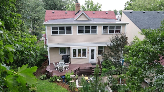 2145 Knapp St, Saint Paul, MN 55108 - rear view of property featuring a chimney and a deck