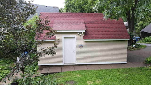 2145 Knapp St, Saint Paul, MN 55108 - back of property with a shingled roof and an outbuilding