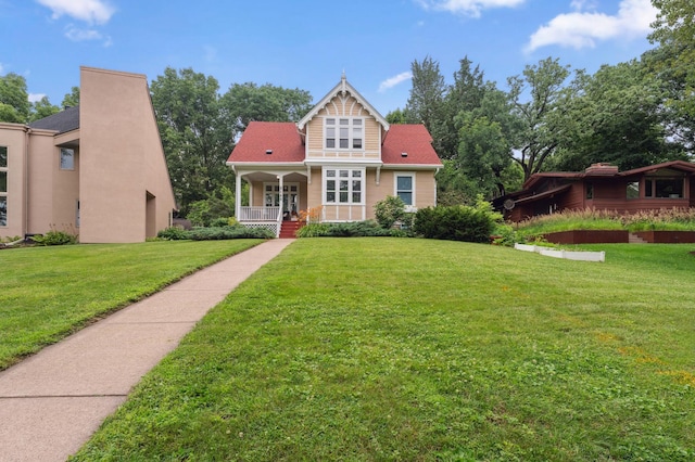 2145 Knapp St, Saint Paul, MN 55108 - view of front of house featuring a porch and a front lawn