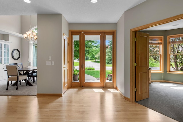 3933 Donegal Way, Eagan, MN 55122 - foyer entrance with light wood-type flooring, a chandelier, recessed lighting, and a textured ceiling