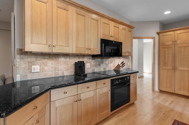 3933 Donegal Way, Eagan, MN 55122 - kitchen with black appliances, light brown cabinetry, light wood finished floors, dark stone counters, and recessed lighting