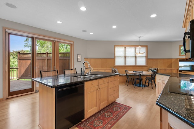 3933 Donegal Way, Eagan, MN 55122 - kitchen with black appliances, plenty of natural light, wainscoting, light wood finished floors, and dark stone countertops