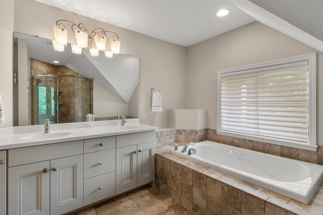 3933 Donegal Way, Eagan, MN 55122 - bathroom with a stall shower, a bath, vaulted ceiling, double vanity, and recessed lighting