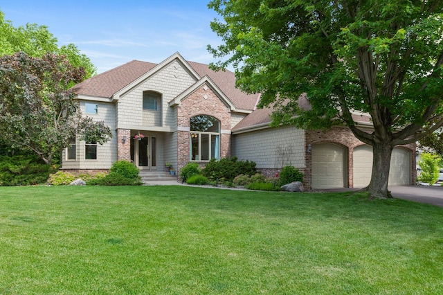 3933 Donegal Way, Eagan, MN 55122 - view of front of property with brick siding, a front yard, an attached garage, and roof with shingles
